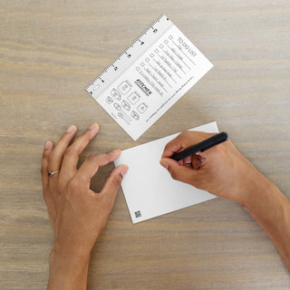 Healthy Affirmations postcard with a to-do list, kitchen conversions and ruler; front and blank writing side, with a hand holding a pen.