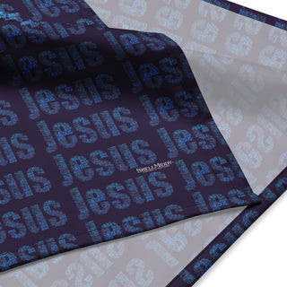 Close-up of folded Jesus Microtype bandana showing the printed face and pale reverse.