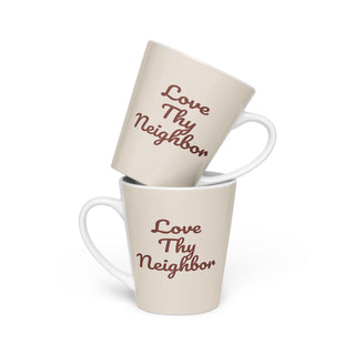 Cream-colored Love Thy Neighbor latte mug with burgundy script, two mugs stacked.