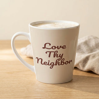 Cream-colored Love Thy Neighbor latte mug with burgundy script, full front view.