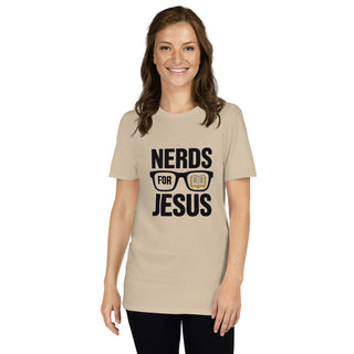 A woman wearing a beige crewneck t-shirt with a black graphic that reads 'NERDS FOR JESUS' with a book icon inside glasses, set against a plain white background.