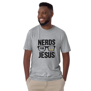 A smiling man wearing a heather gray t-shirt with a black graphic that reads 'NERDS FOR JESUS' with glasses and an open book, paired with khaki pants, against a plain white background.