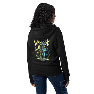 woman wearing a black Walk in Light zip hoodie with text on the back, standing against a white background.