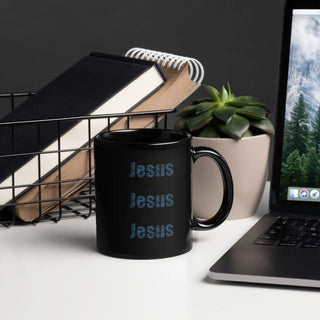 Black mug with 'Today's Match' text on a desk with laptop, books, and plant