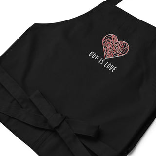 Black apron laid flat, showing floral heart embroidery and the words God Is Love.