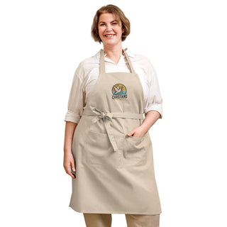 Woman wearing the beige Christians For Christ apron with a front waist bow and divided pocket.