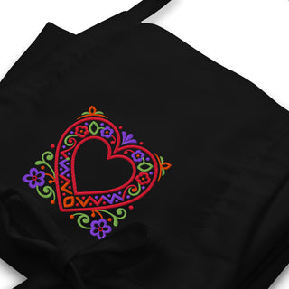 Folk Heart apron with colorful heart embroidery, black embroidery close-up.
