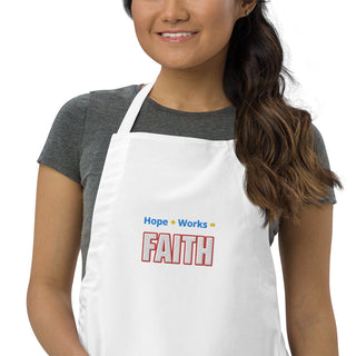 Hope + Works = Faith embroidered apron; white, cropped front on a model.