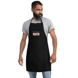 Hope + Works = Faith embroidered apron; black, full front on a bearded model.
