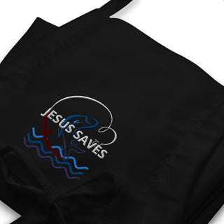 Jesus Saves embroidered apron with waves and a small boat design; black embroidery close-up.