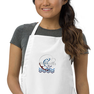 Jesus Saves embroidered apron with waves and a small boat design; white, cropped front on a model.