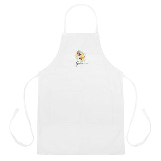 Full front view of the white Amazing Grace apron with pockets and long ties.
