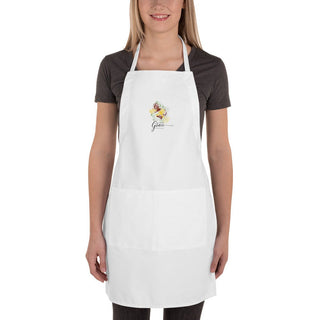 Woman modeling the white Amazing Grace apron, front view.