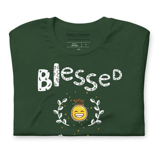 Green T-shirt with Blessed and Highly Favored lettering with a smiling sun, folded, close-up of lettering and sun