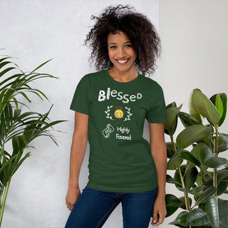 Green T-shirt with Blessed and Highly Favored lettering with a smiling sun, modeled beside plants