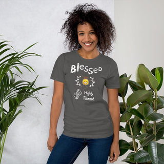 Dark gray T-shirt with Blessed and Highly Favored lettering with a smiling sun, modeled beside plants