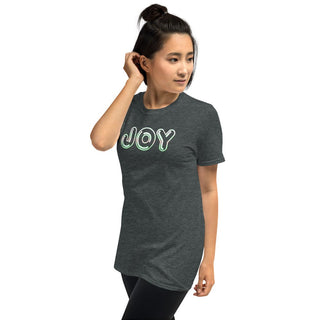 Dark gray T-shirt with outlined JOY bubble lettering, modeled with a hand near the ear