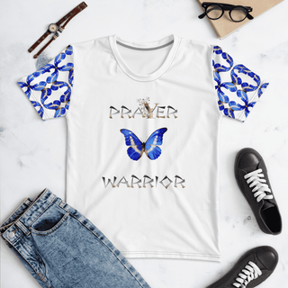 White T-shirt with Prayer Warrior lettering and blue butterflies, laid flat with jeans and shoes