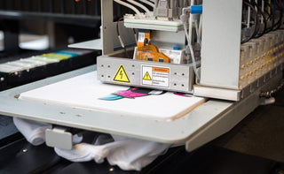 T-shirt printing machine applying a colorful design