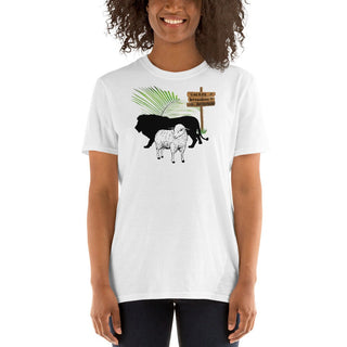 White T-shirt with The King Is Coming lion, lamb and palm design, modeled by a woman with curly hair